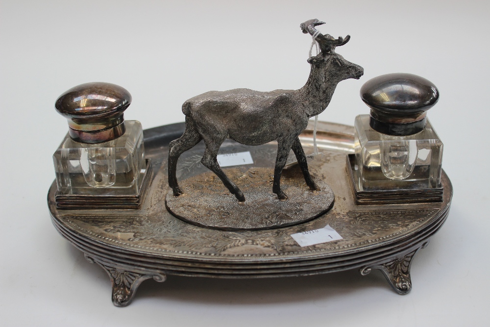 A late 19th Century/early 20th Century EPNS writing/desk stand with two capped inkwells, a pen