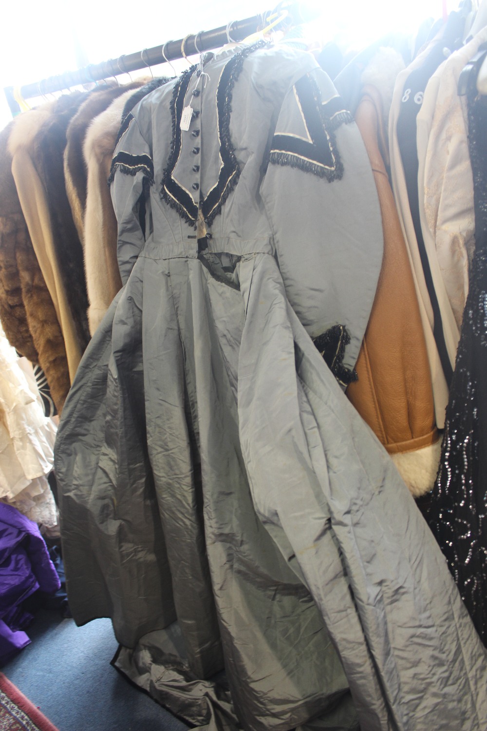 One grey silk taffeta Victorian dress decorated with jet droplets and scalloped edge with jet button