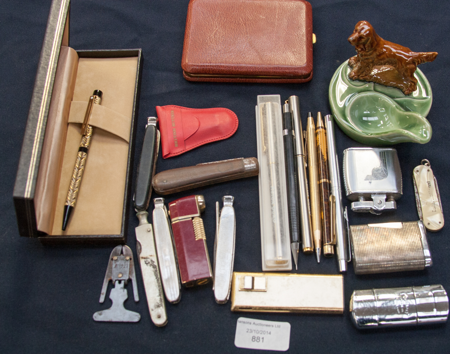 A collective lot of pipe tampers, lighters , ball point pens, cigarette case etc to include cigar