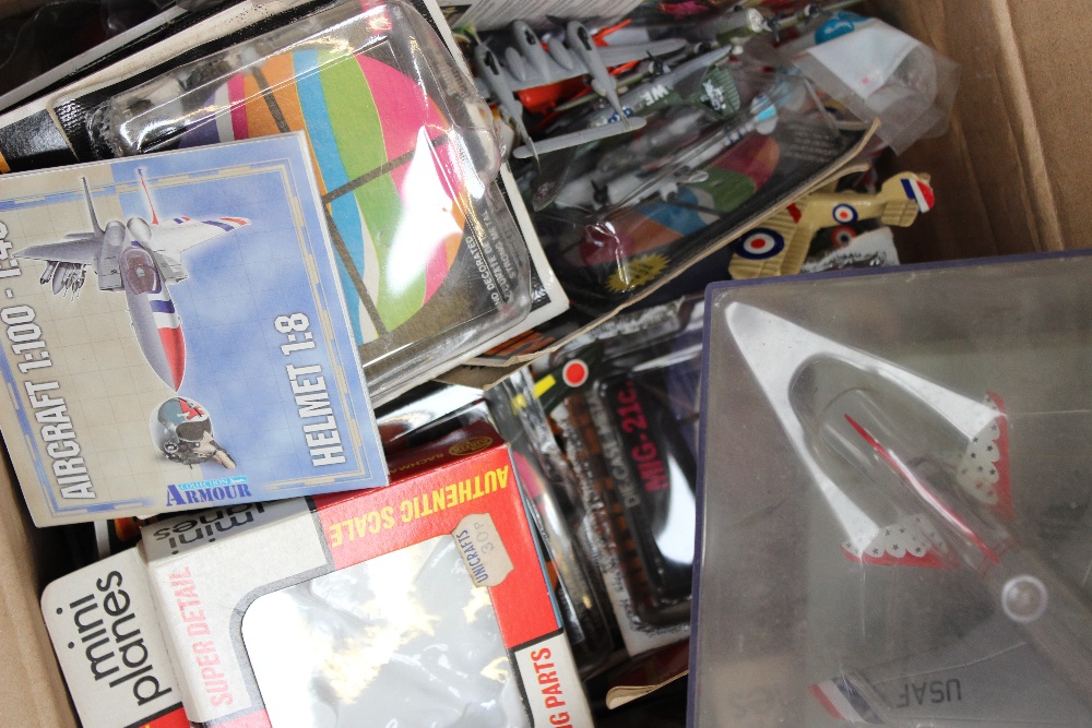 A box containing various small scale diecast airplanes to include Dinky Meteor, Shooting Star,