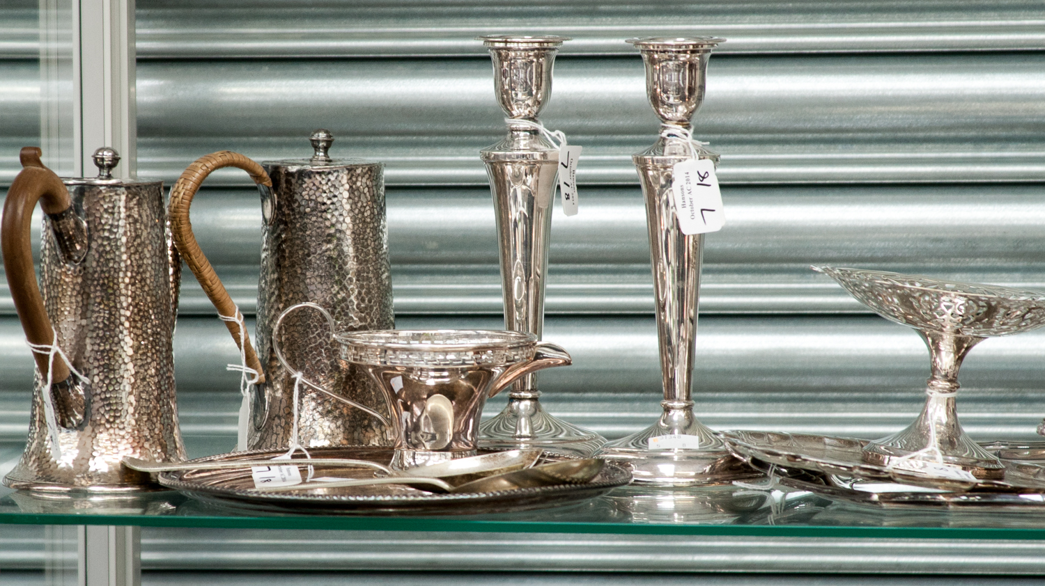 A collection of silver plated items, including an Arts and Crafts planished coffee pot and