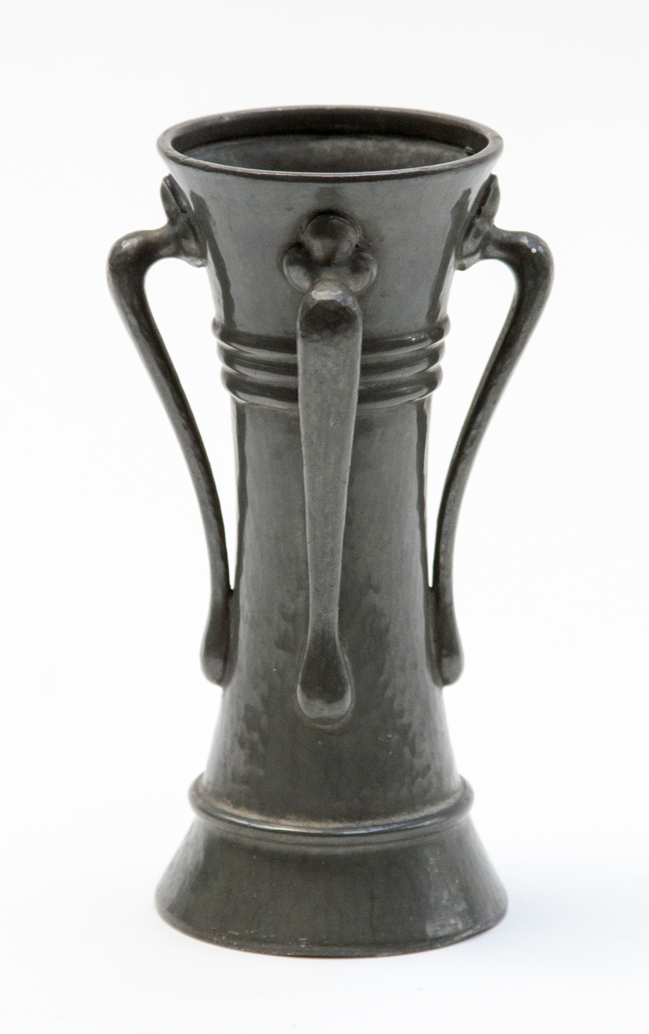 A Liberty Tudric pewter vase, of waisted form with four handles, in the style of Oliver Baker,