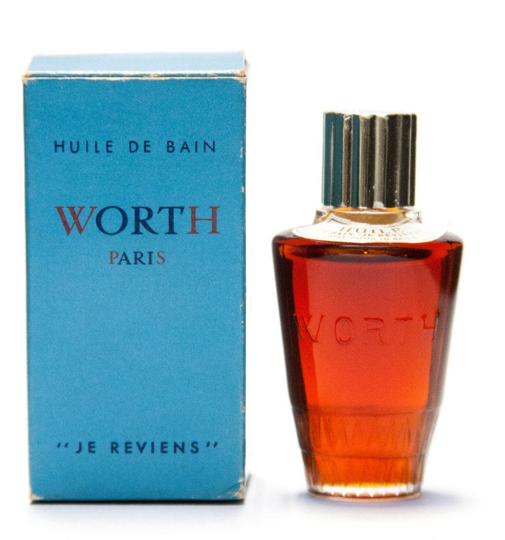 A Lalique small perfume bottle, Worth huile de bains, J E Reviens,  in original box