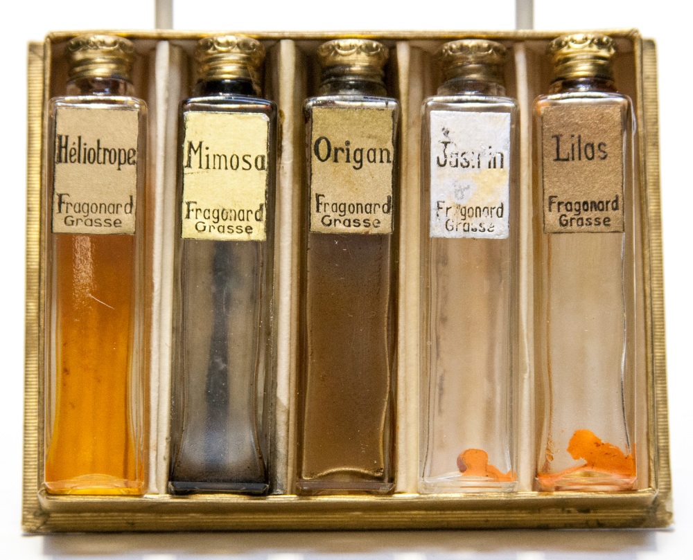 A box of five perfume bottles, possibly Coty, 'F R Aganard Grasse' circa 1920s, Shagreen style lid