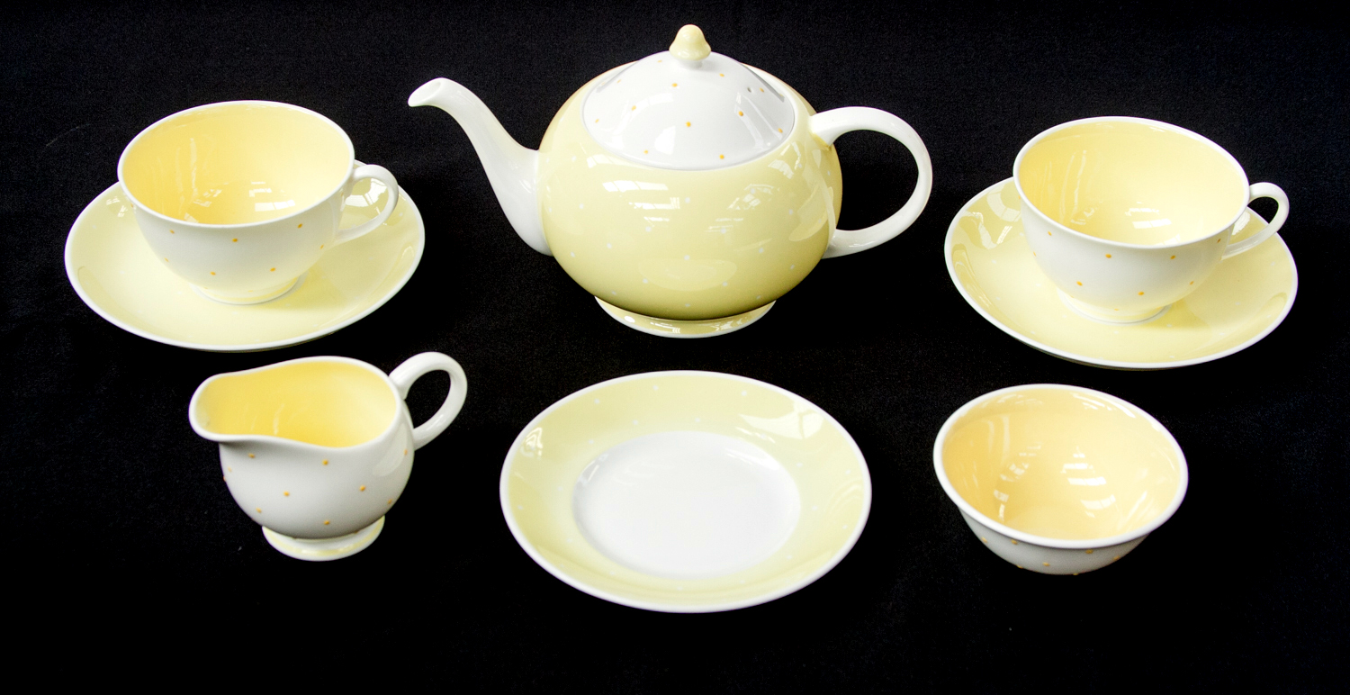 A Susie Cooper tea set for two, circa 1950, yellow polka dot design, including teapot, jug, bowl,