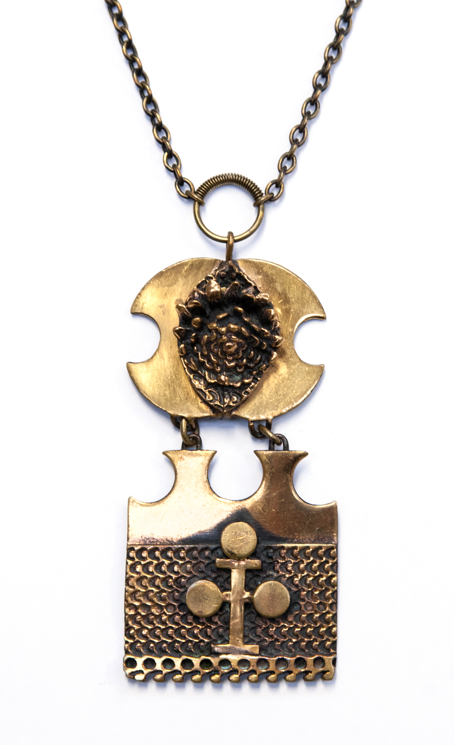 Pentti Sarpaneva, a 1970s Finnish bronze pendant on chain, cast with textured and applied