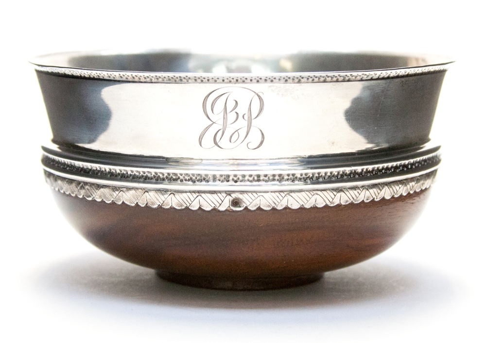 An Arts and Crafts silver and mahogany bowl, in the 17th century style, the outer edge with simple