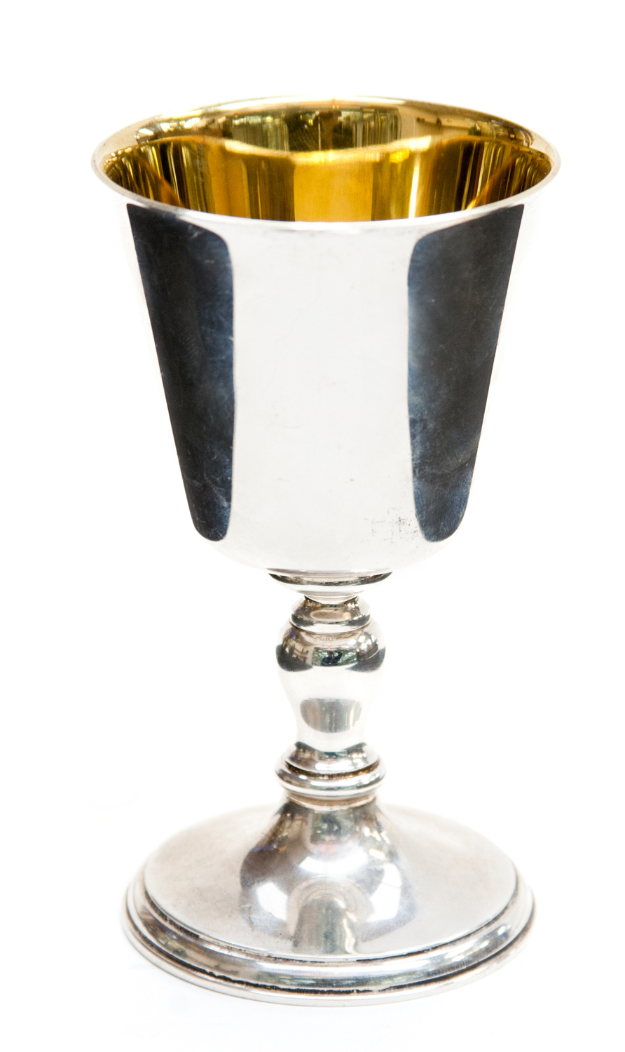 An Albert Edward Jones silver goblet, the gilt lined conical shaped bowl raised on an inverted