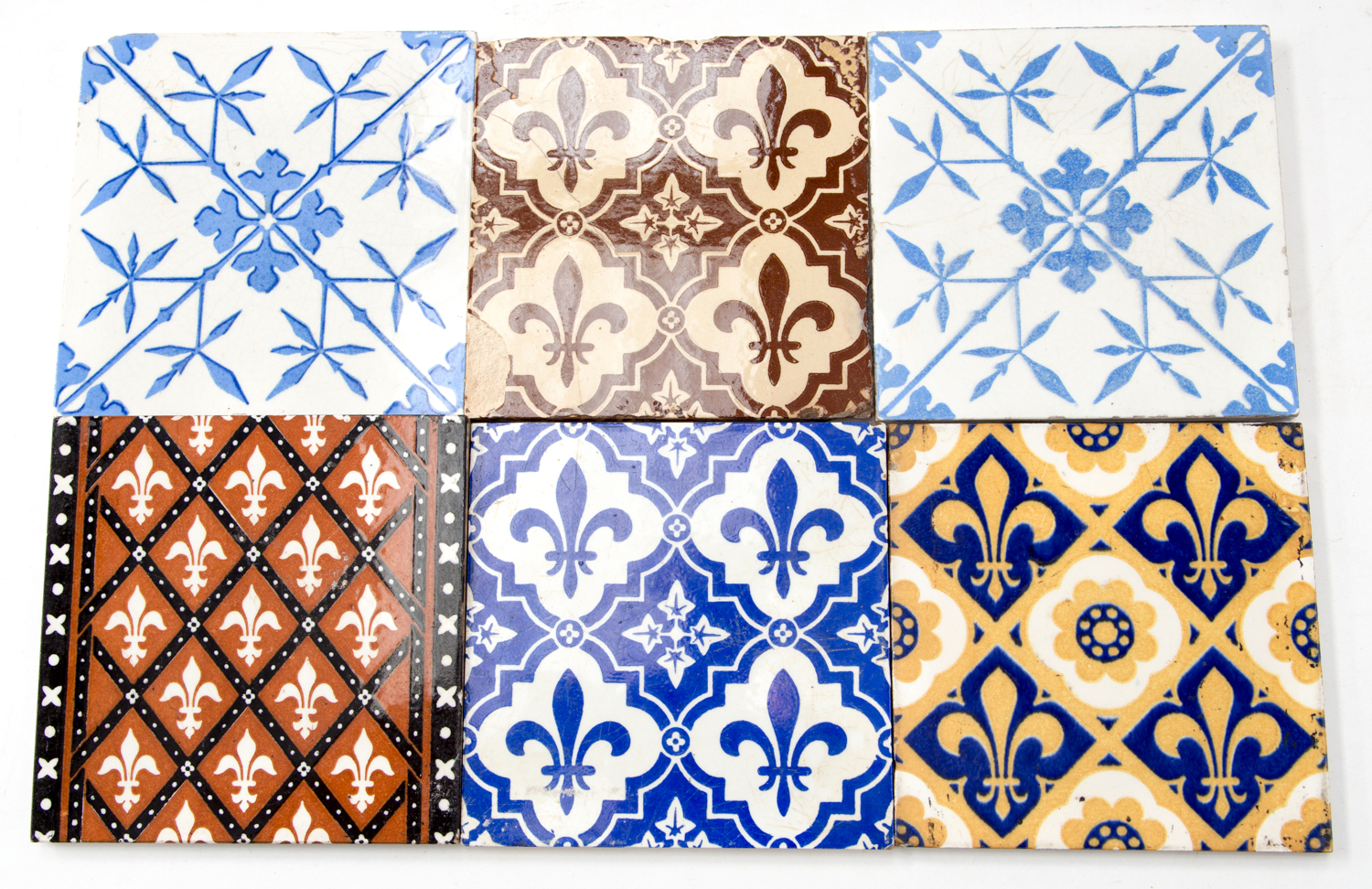 Six Victorian tiles attributed to A W N Pugin, most by Minton and Minton, Hollins & Co., decorated