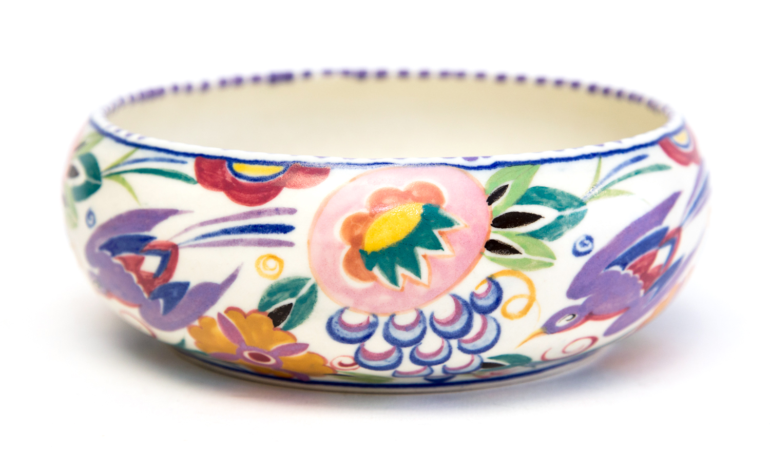 An early 20th Century Poole pottery bowl, probably designed by Truda Carter with bird and flower