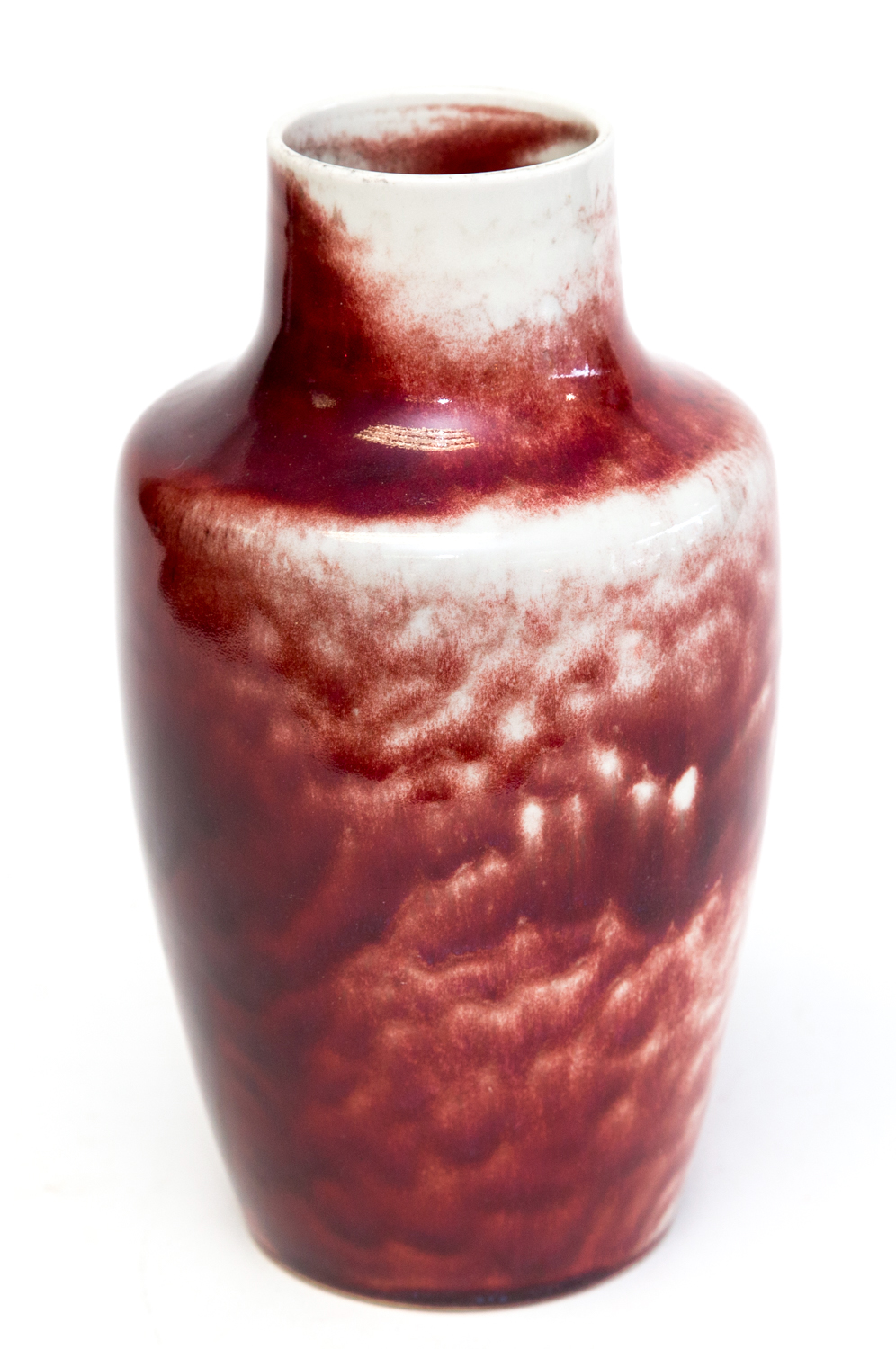 Ruskin Pottery, a high fired vase of shouldered form, glazed in red and cream, impressed marks and