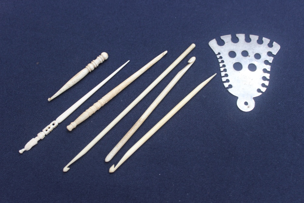 A selection of bone/Ivory/Ivorine crochet hooks (6) and a Abel Morrell knitting needle gauge