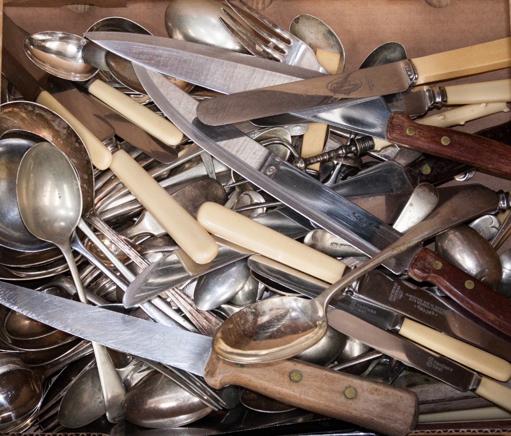 A collection of 19th and 20th Century silver plated flatware comprising spoons, forks and knives