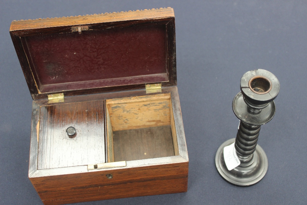 A rosewood tea caddy (one section with lid) ebony knob, Victorian, an ebony candlestick and a