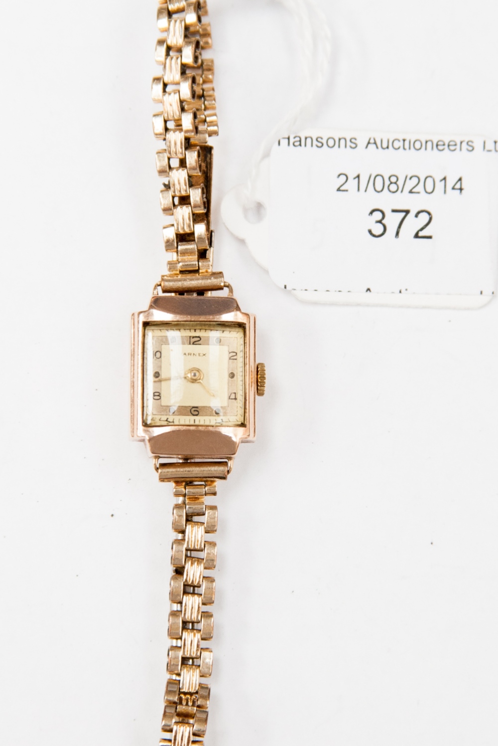 A 9ct gold Arnex ladies wristwatch on a plated strap