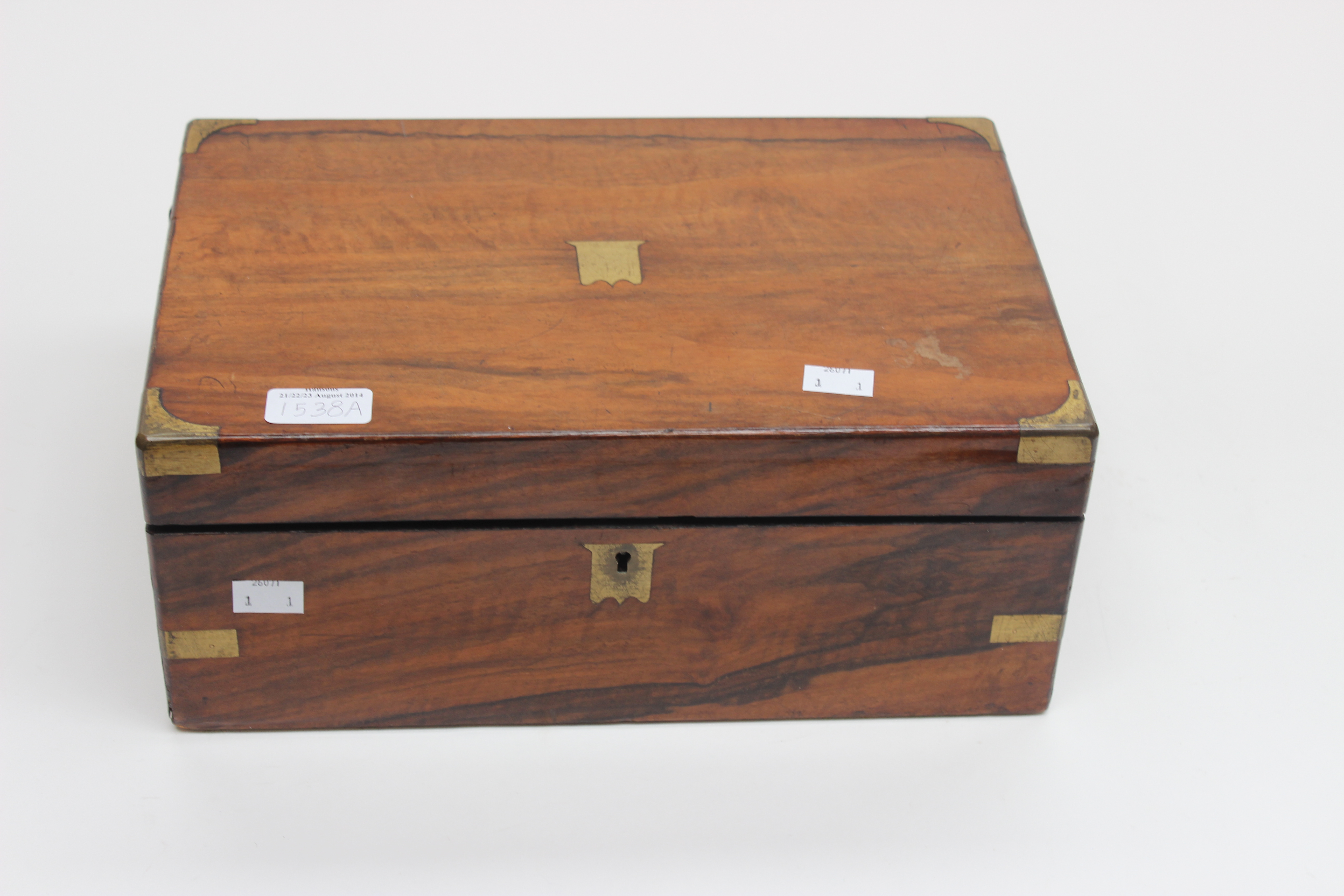 A Victorian rosewood writing slope with lacquered brass corners and fittings.