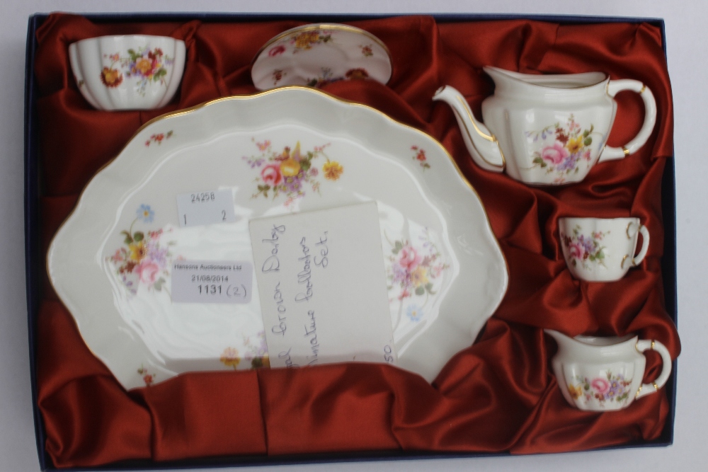 A boxed Royal Crown Derby, Derby posies miniature tea set; together with a Crown Derby Badger