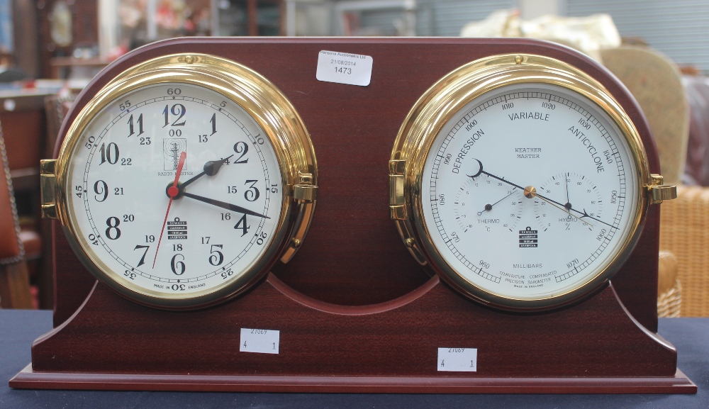 A modern clock and barometer set, fitted in a mahogany casing