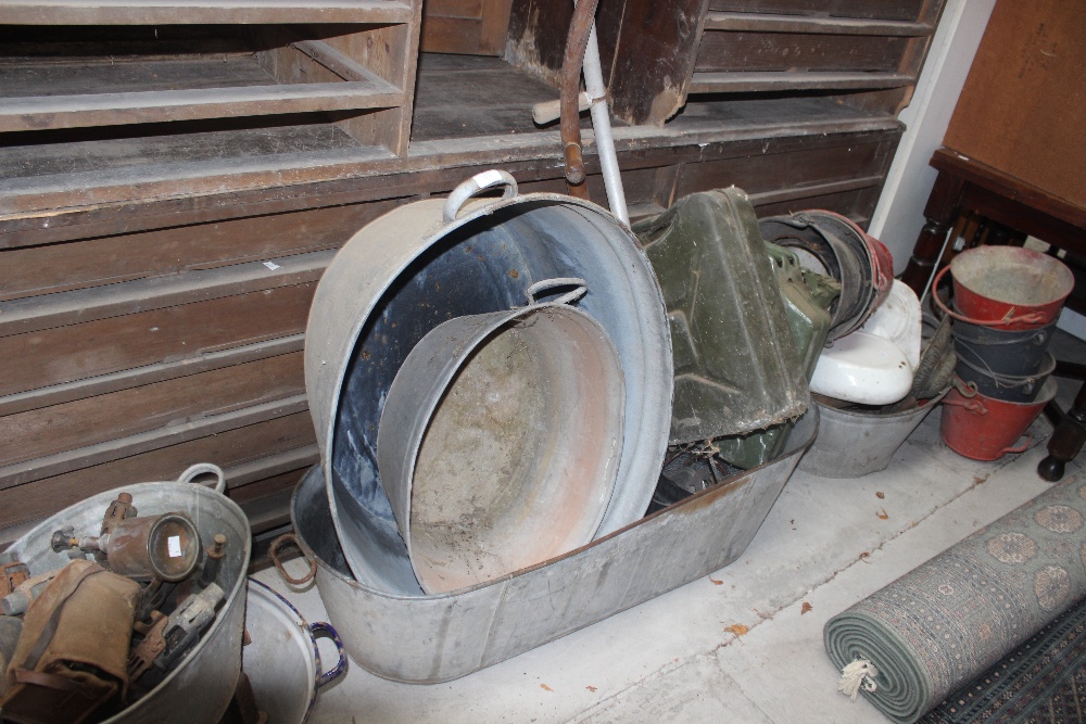 Enamel ware, cast iron, galvanized tin baths, scythes, petrol cans, fire buckets, horse shoes,