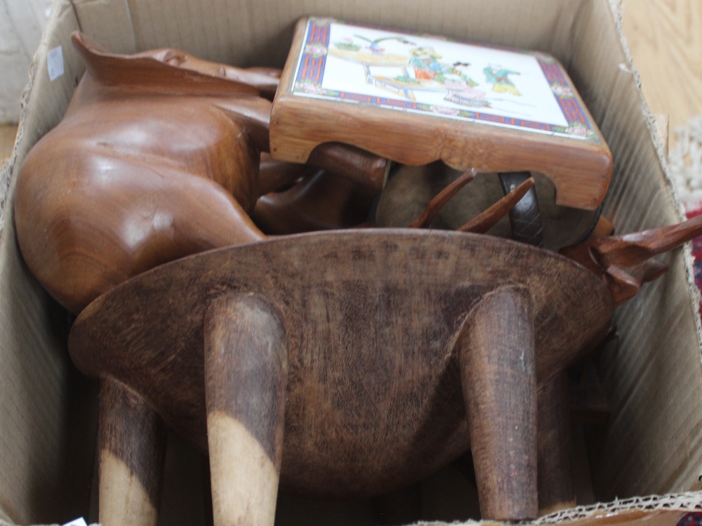 A box of treen items, including coconut shells, carved animals and bowls, etc