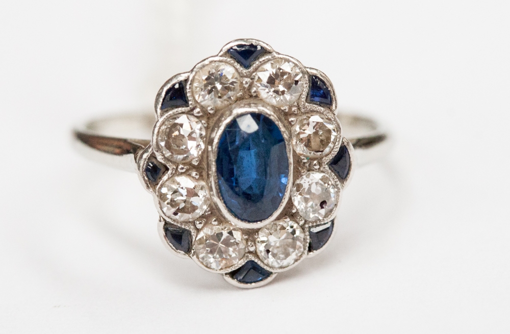 An Art Deco sapphire and diamond ring set in white gold and platinum, the central sapphire