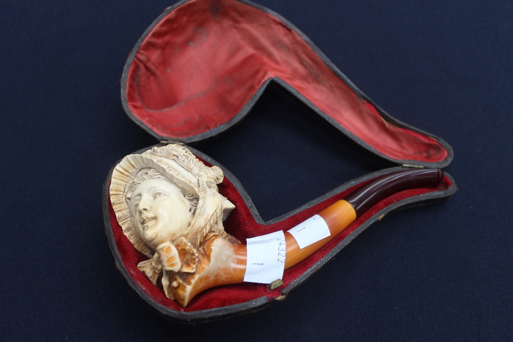 A case Meerschaum pipe with the bowl, carved as a ladies head