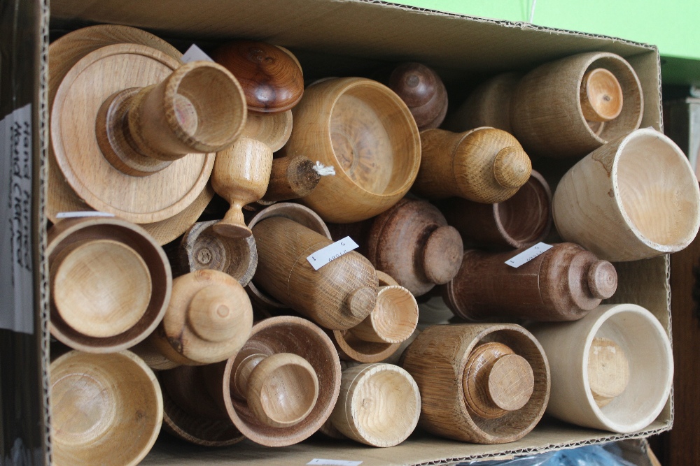 A box of turned wood bowls, objects and lidded bowls.