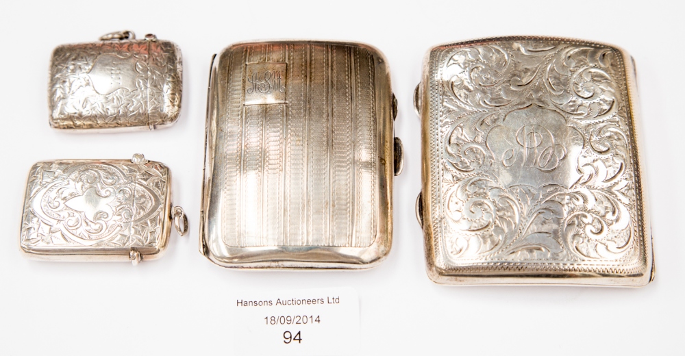 Two silver cigarette holders, gilt lined, with two silver match strikers, total weight approx 5.
