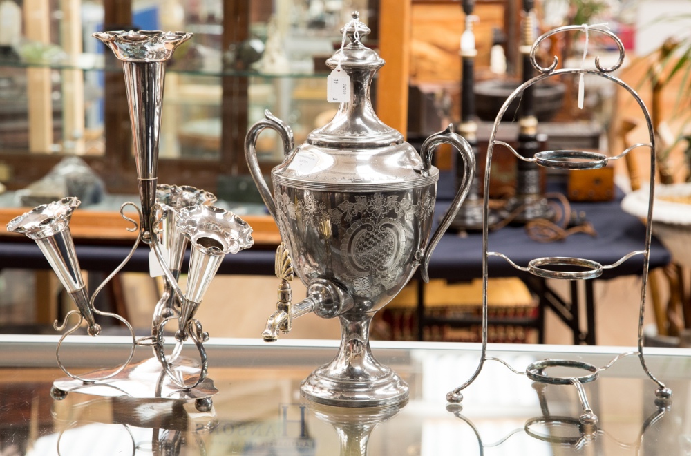 A box of silver plate comprising a samovar, a four branch epergne and a three tier stand