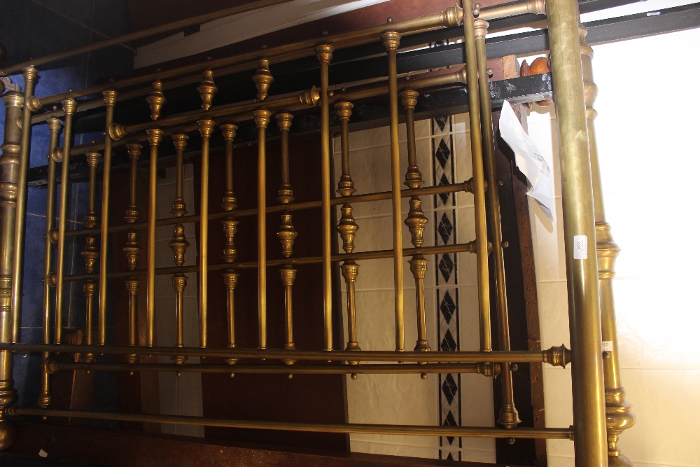 A Victorian brass bed, with foreboard and backboard