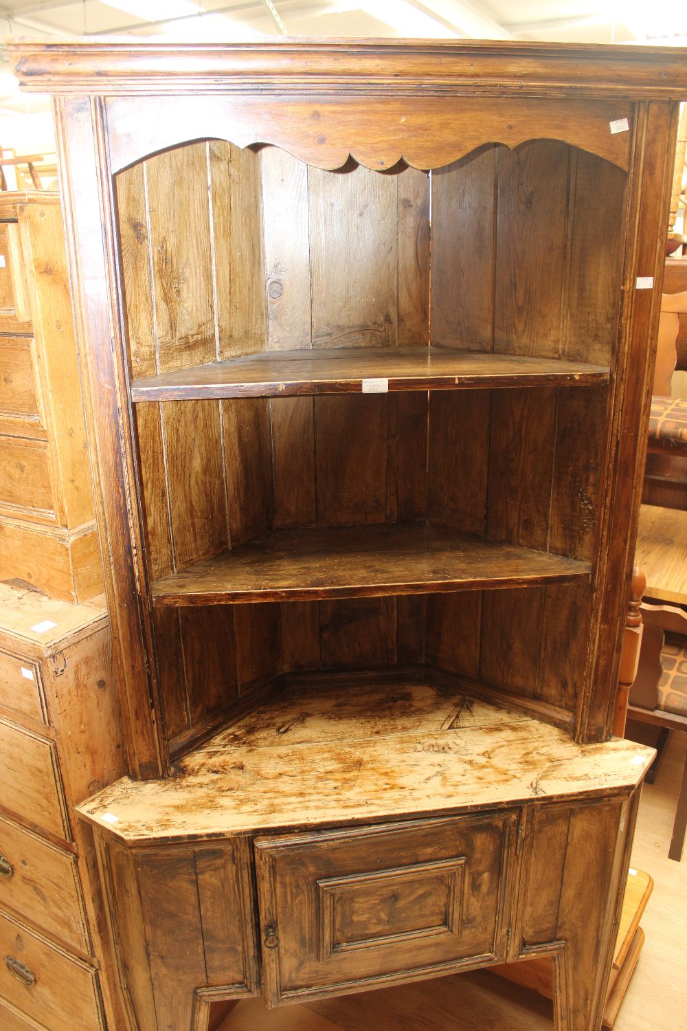 An early 20th century wood grained corner unit