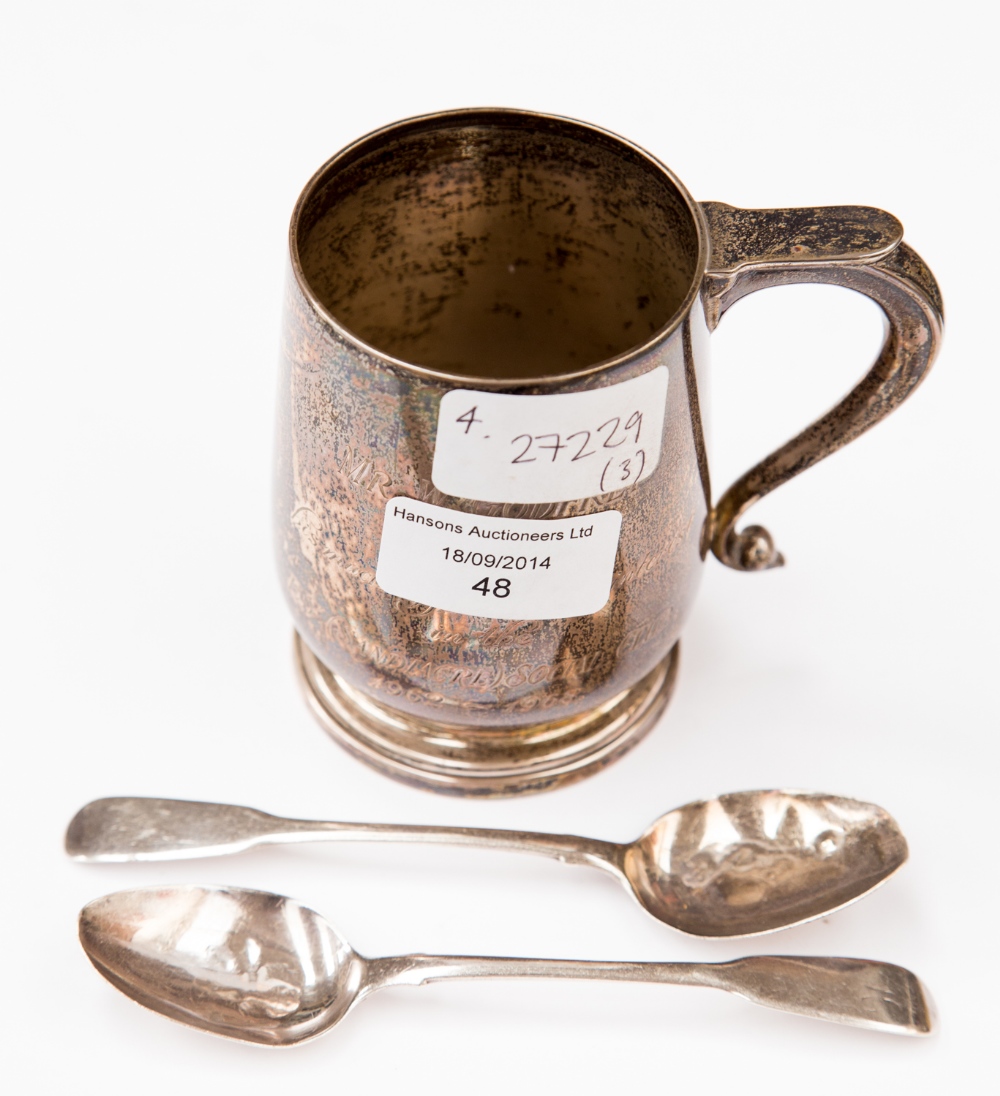 A silver tankard and two silver teaspoons