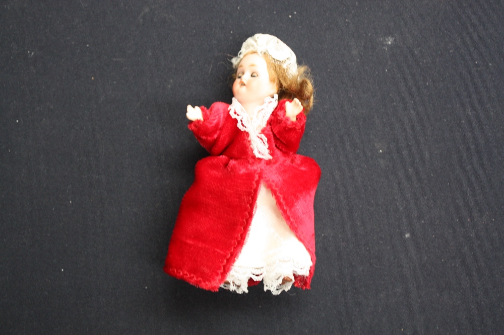 A small bisque head doll, German, six inches approx