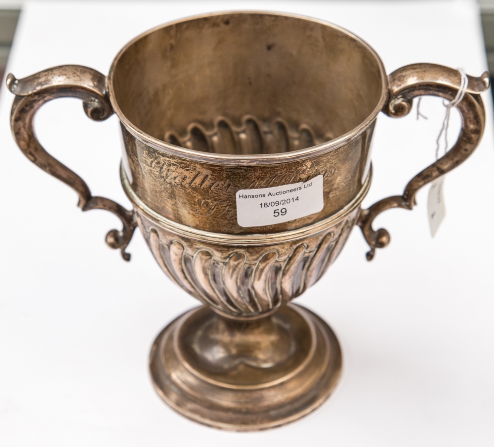 A late Victorian silver twin handled trophy cup inscribed 'William Atkins Trophy', makers JP FP,