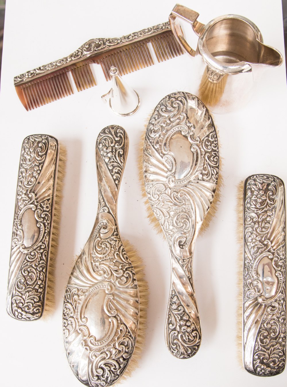 Silver backed brushes (4) and comb; together with a plate jug and candle snuffer