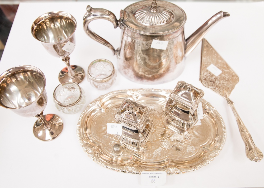 A pair of silver salts, plated condiment set and tray, two goblets and a tea pot and cake slice