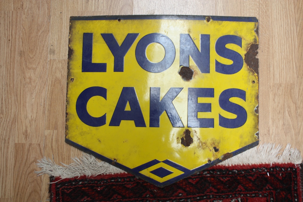 An early 20th Century enamelled metal sign 'Lyons Cakes'