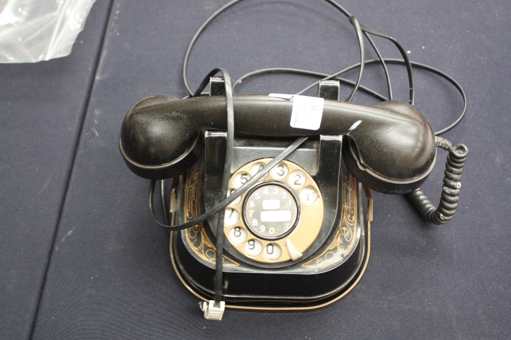 A black metal telephone with Bakelite handset 'Belgique' by Bell Telephone MFG Company