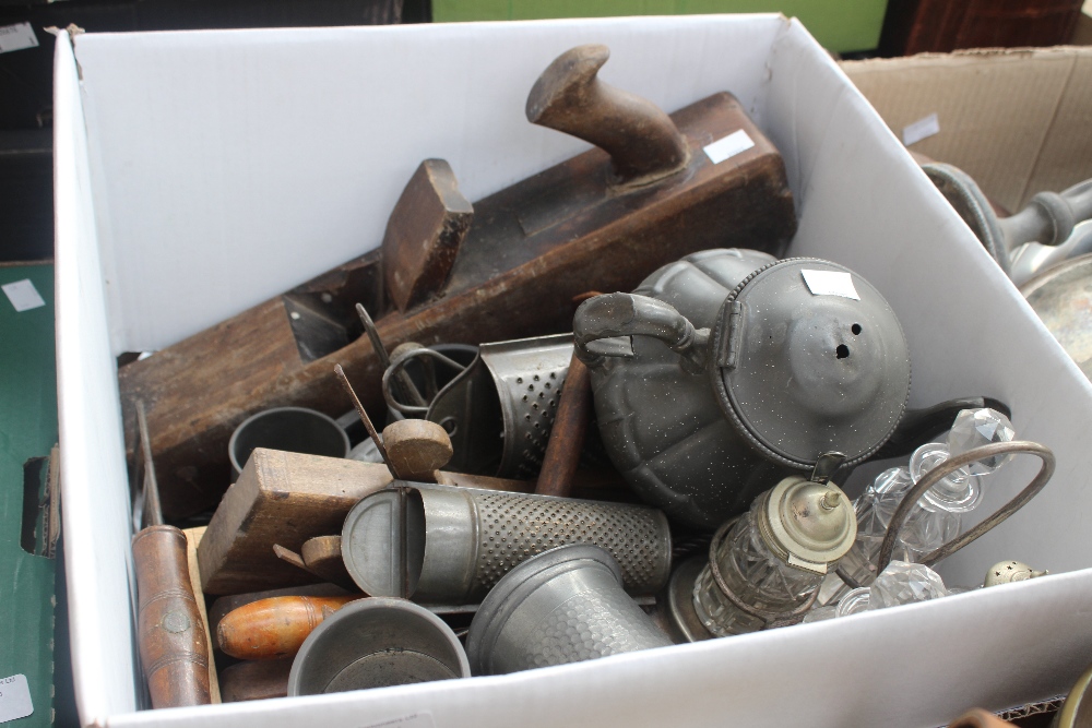 A tray of wood working tools including planes, companion set, pewter, Brownie camera and vintage