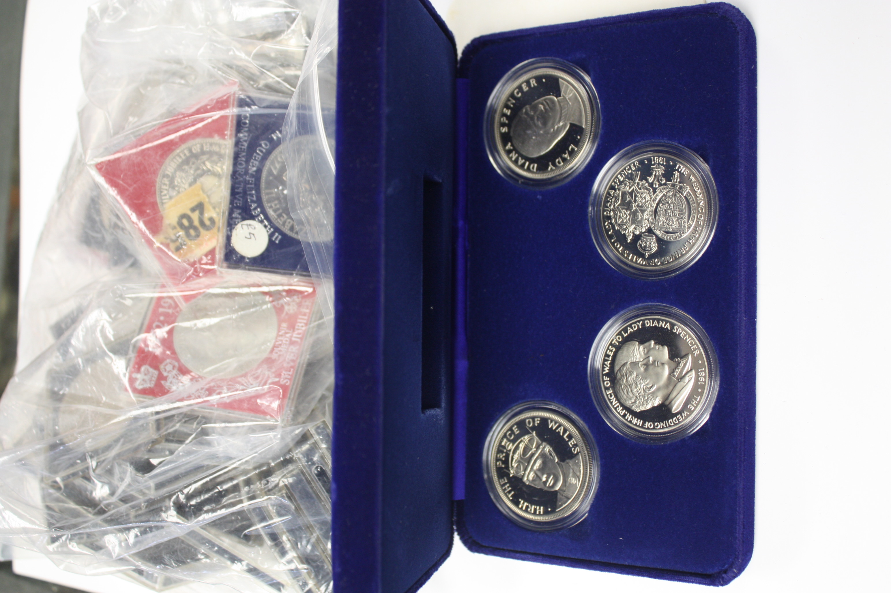 More than 75 Five Shilling coins, 1953 and 1960, along with 6 souvenir medals 1977 and also boxed