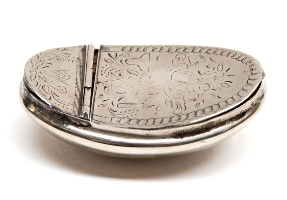 A late 18th century Paktong snuff box, circa 1780, of concave oval form, the lid engraved with