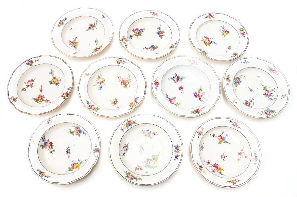 Ten late 18th Sèvres porcelain soup plates, Sèvres marks and foot rim hole, decorated with floral