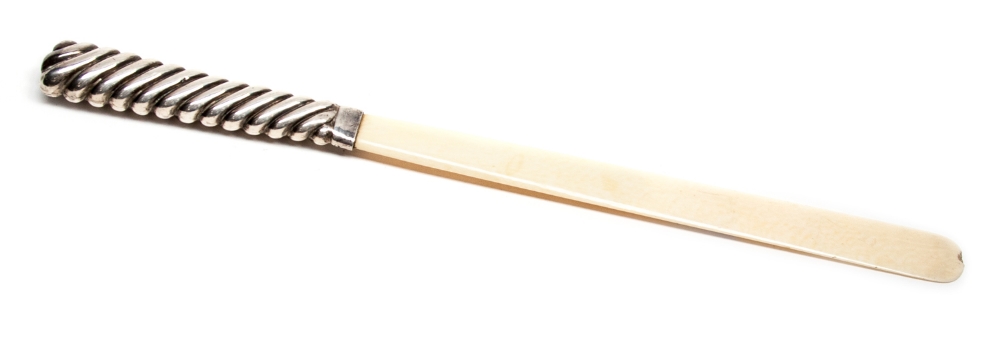 A late Victorian silver handled, ivory page turner, the handle of reeded wrythen form, circa 1900,