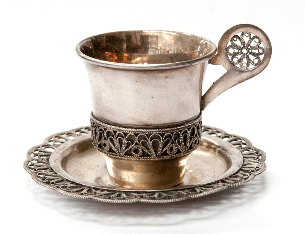 A Russian silver cup and saucer with ropework filigree decoration, both stamped on base 710MMET ^KN,