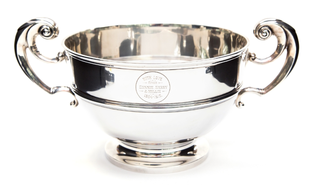 A George V Irish silver twin handled rose bowl, of plain 18th century form with ear scroll