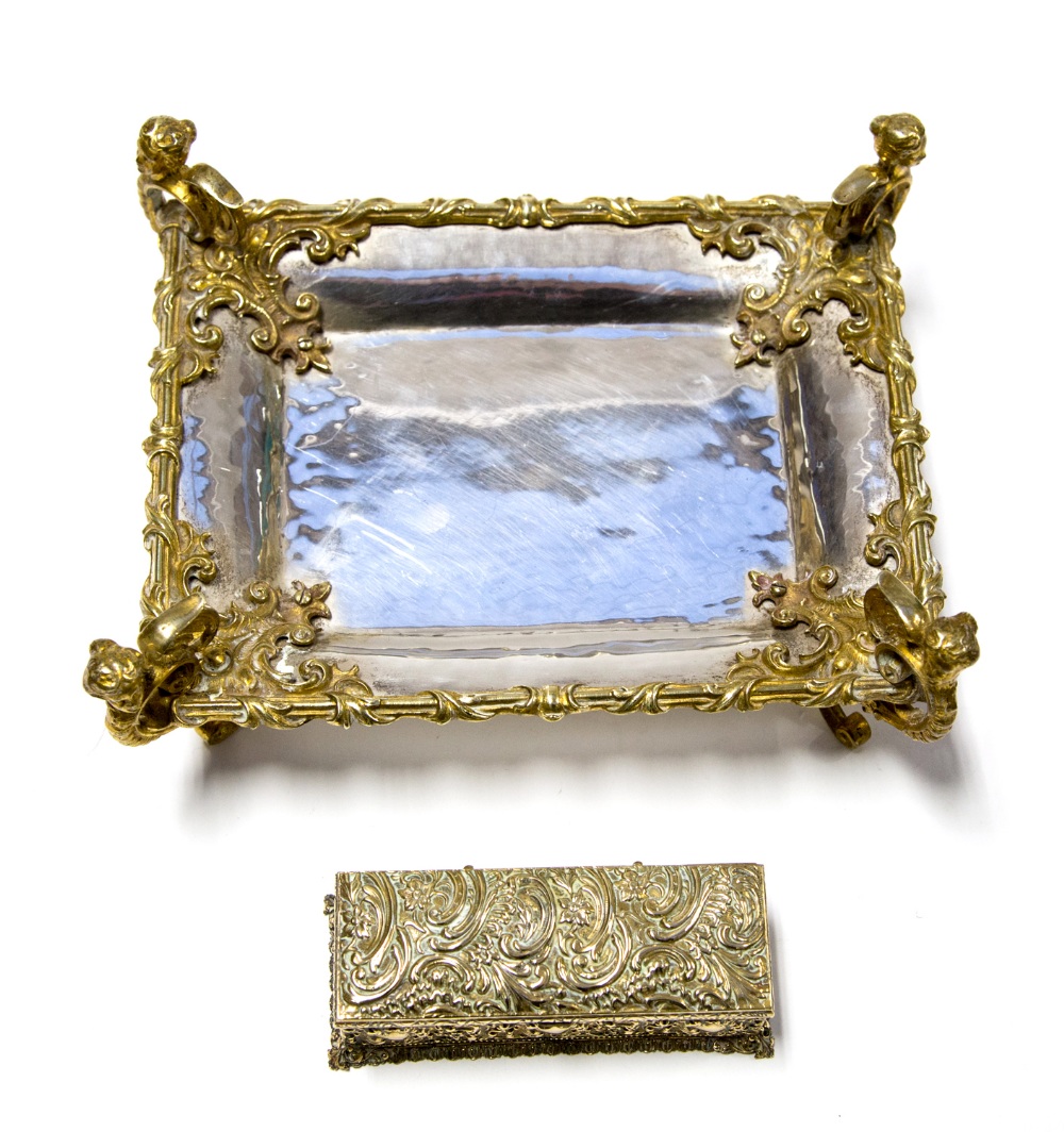 A modern Guild of Handicraft silver pen tray with gilt brass mounts and supports in the late 19th