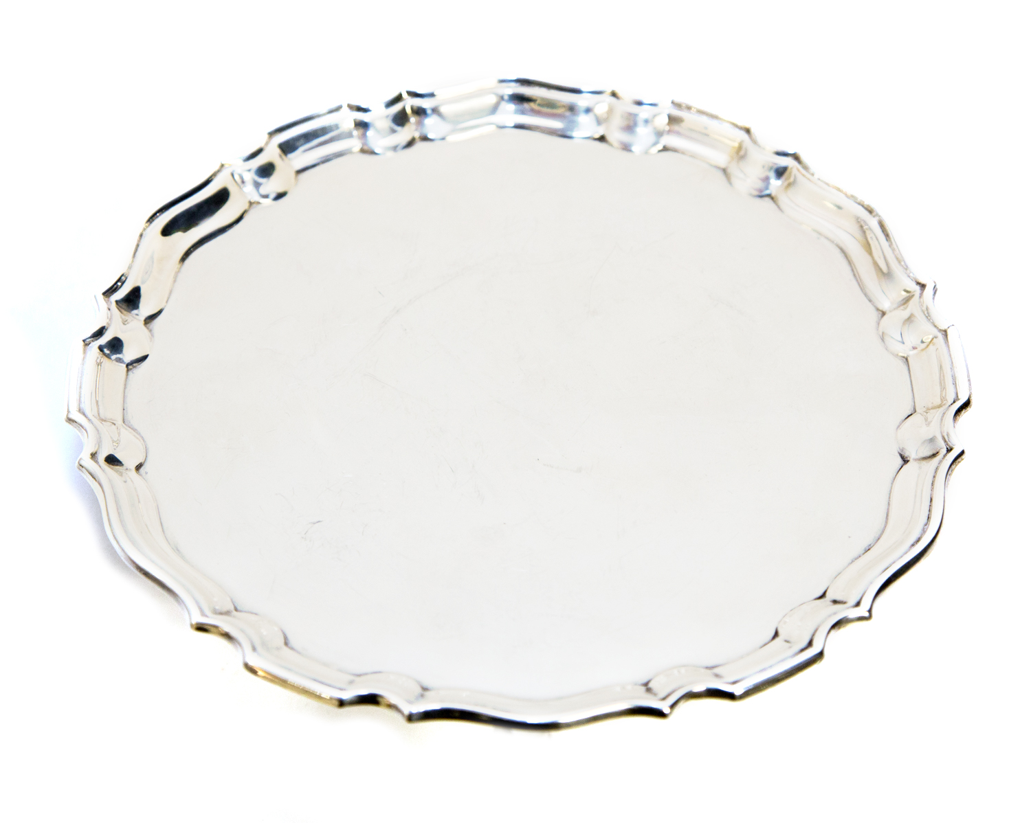 A George V silver three footed salver, made for Tiffany & Co, fluted ogee border on hoof stepped