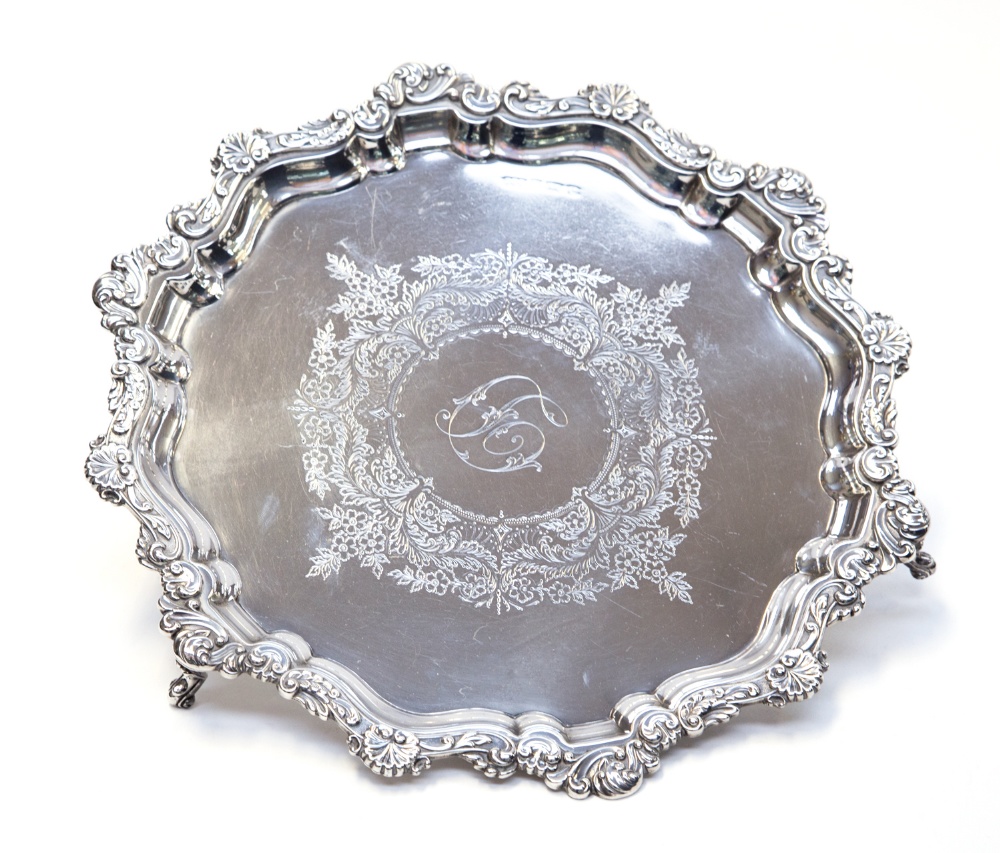 An Elkington and Co Edwardian silver salver, scroll and scallop border, central initial within