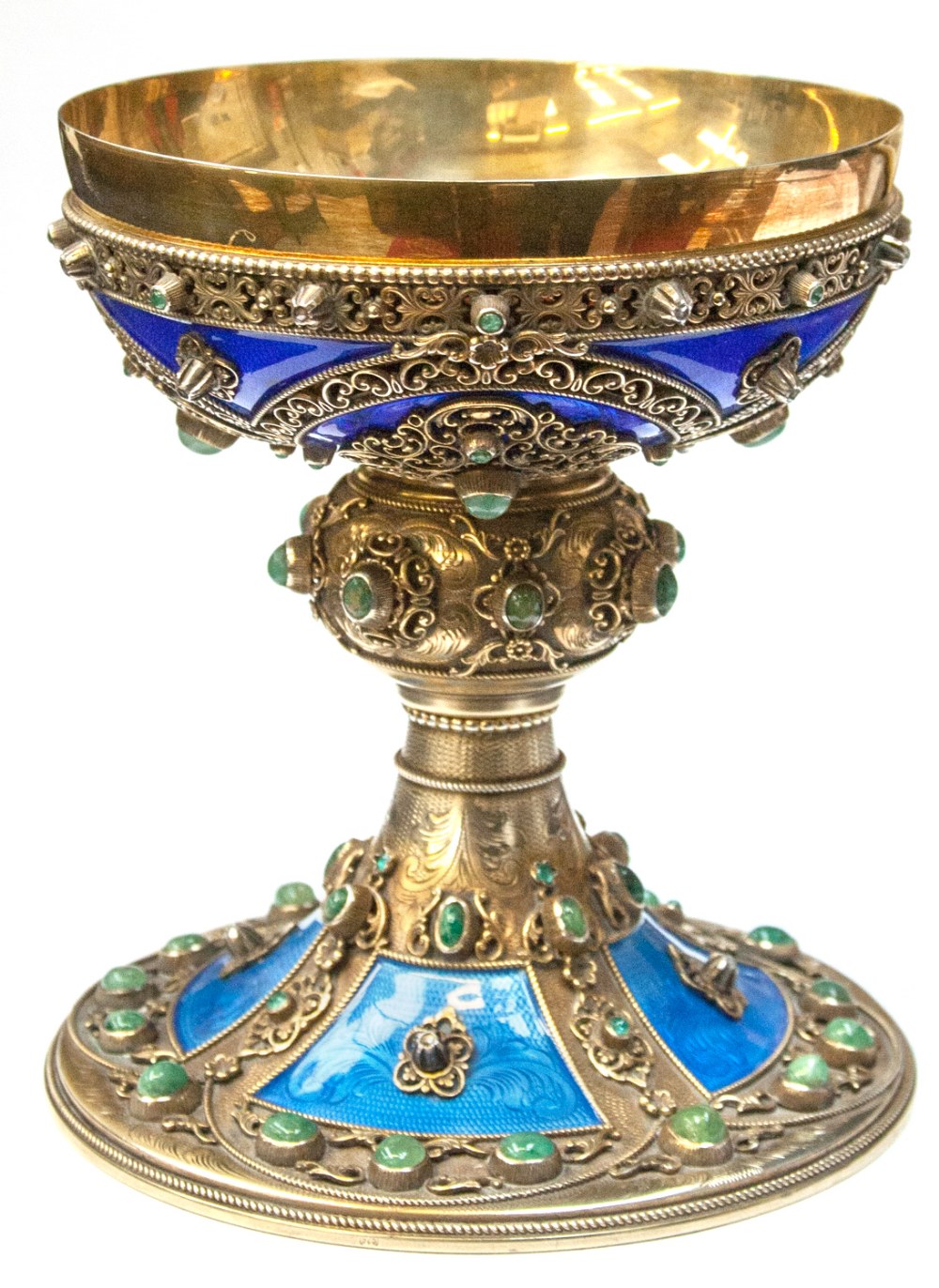 A mid 19th century silver gilt chalice, probably Eastern, elaborately decorated with various