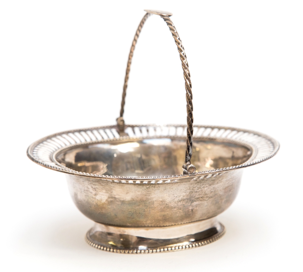 A George III Newcastle silver basket or dish, of Neoclassical form with reticulated and bead edged